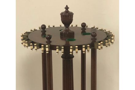 Antique walnut cue rack with original cue clips