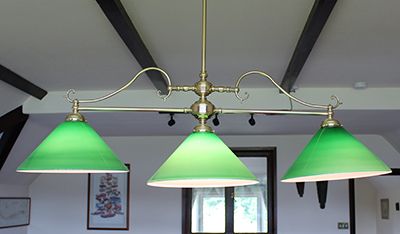 brass pool light with 3 green shades