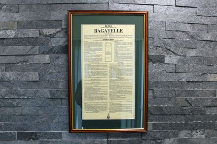 Bagatelle rules framed in a mahogany frame