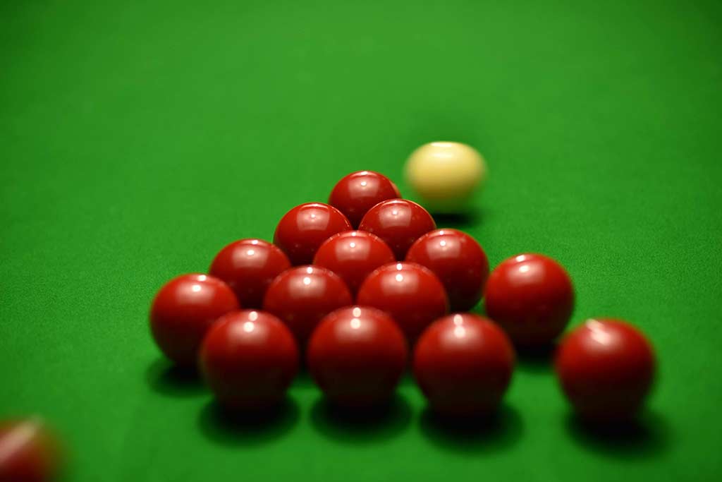 snooker balls on green felt table